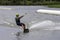 Teenager wakeboarding on a lake - Brwinow, Masovia, Poland