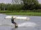 Teenager wakeboarding on a lake - Brwinow, Masovia, Poland