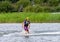 Teenager wakeboarding on a lake - Brwinow, Masovia, Poland