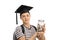 Teenager wearing graduation hat and holding jar filled with money