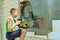 A teenager works on a construction site using an electric jackhammer, the concept of exploiting child labor