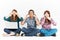 Teenagers In 3 Wise Monkeys Pose Holding Gadgets