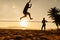 Teenagers balance on slackline silhouette