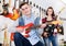 Teenagers choosing electric guitar