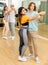 Teenagers dancing in pairs slow ballroom dances in choreography class