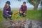 Teenagers enjoying barbecue outdoors