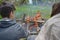 Teenagers enjoying barbecue outdoors