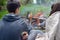 Teenagers enjoying barbecue outdoors