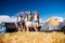 Teenagers in front of tents with backpacks, summer festival