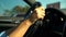 Teenagers hands holding black steering wheel, girl driving car uncertainly