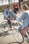 Teenagers having fun and riding bicycles in skateboard park