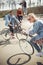 Teenagers having fun and riding bicycles in skateboard park