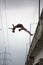 Teenagers jumping back side from a bridge, Ecuador