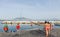 Teenagers jumping into the sea in Naples