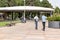 Teenagers in medical masks walk in the Park on a Sunny day