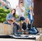 Teenagers musicians playing by instruments in park