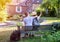 Teenagers people and travel concept. Teens  sitting on the bench and making photos in the street of an old town, Rochefort-en-