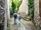 Teenagers people and travel concept. Teens walking in the street of an old town, historical centre of the town, Rochefort-en-Terre