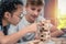 Teenagers play Jenga game together