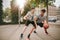 Teenagers playing basketball on outdoor court