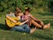 Teenagers playing guitar