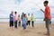 Teenagers playing skipping rope