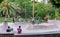 Teenagers are practicing riding skateboards and bicycles at outdoor skate park in La Granja Park, Santa Cruz de Tenerife, Canary