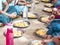 Teenagers pupils being served Meal plate of rice In government School Canteen. Unhealthy food for poor children