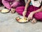 Teenagers pupils being served Meal plate of rice In government School Canteen. Unhealthy food for poor children