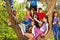 Teenagers sitting on benches of the tree