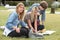 Teenagers sitting on grass