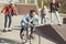 Teenagers spending time in skateboard park, teenagers having fun concept