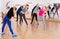 Teenagers stretching in dance hall