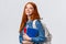 Teenagers, students and education concept. Cheerful lovely redhead female studying, going to univeristy or college