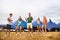 Teenagers at summer music festival dancing in front of tent