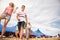 Teenagers at summer music festival in front of big blue tent