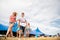 Teenagers at summer music festival in front of big blue tent