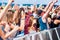 Teenagers at summer music festival having good time