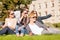 Teenagers taking photo outside with smartphone