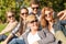 Teenagers taking photo with smartphone outside