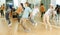 Teenagers training movements of street dance in choreography class