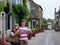 Teenagers travel concept. Children with map walking in the street of an old town, historical centre of the town, Rochefort-en-