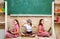 Teenagers young schoolgirls with laptop and vr headset on blackboard at school. Portrait of a teens female students