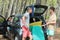 Teens arriving at beach by car