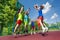 Teens jump for ball during basketball game