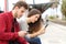 Teens obsessed with smart phones in a train station