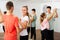 Teens in pairs learning to dance waltz