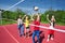 Teens play during volleyball game on playground