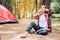 Teens are relaxing and happy by listening to music in the picnic