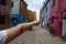 Teens ttravelling in colorful Burano island - Venice, Italy